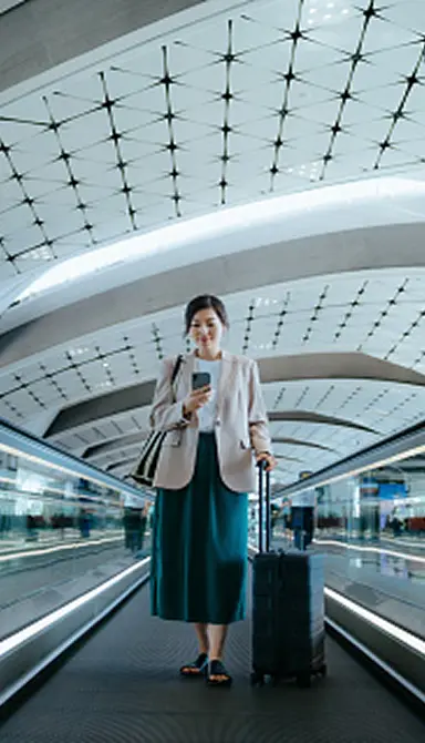 Woman on phone in international airport