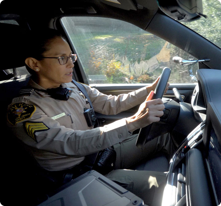 Female officer driving police cruiser in San Luis Obispo County 