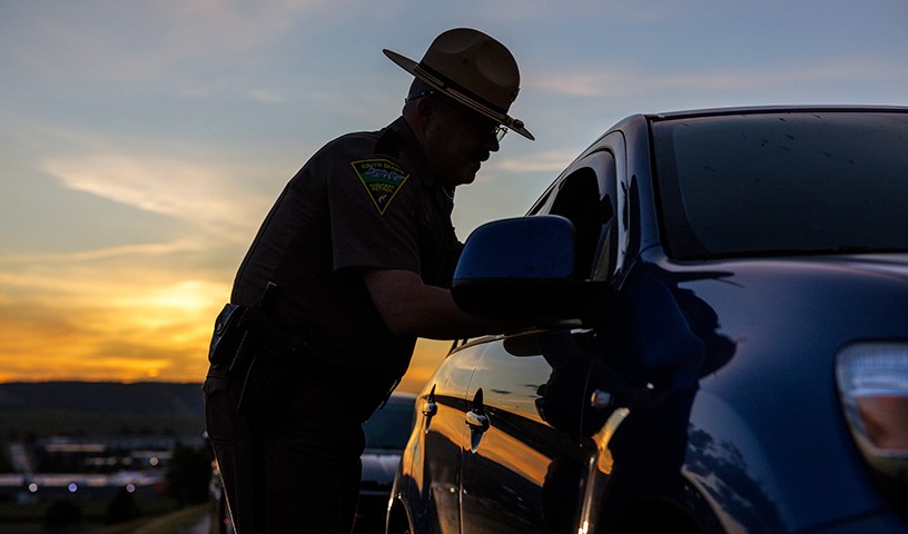 A South Dakota Highway Patrol officer performs a car stop while on duty in South Dakota.