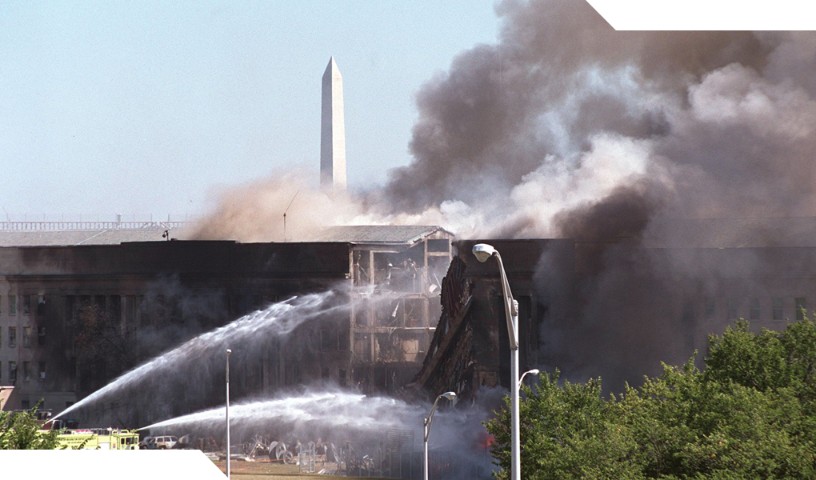 Fire fighters extinguish fires at the Pentagon on 9/11